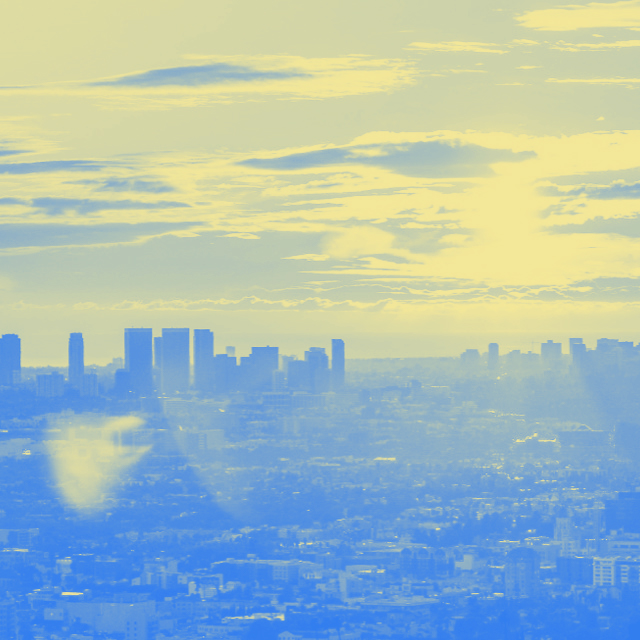 city underneath a sky with a sunset