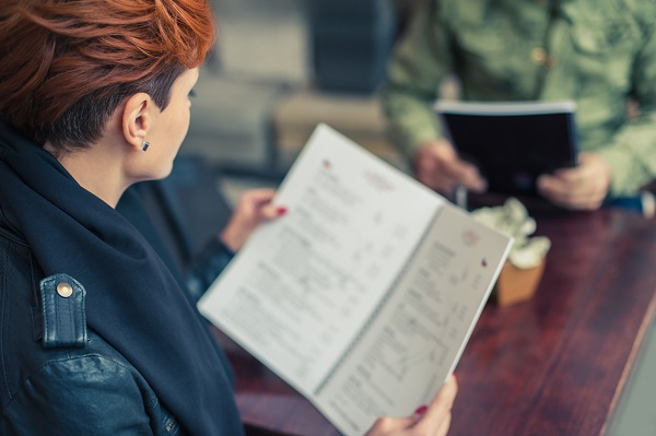 Woman Looking At Menu