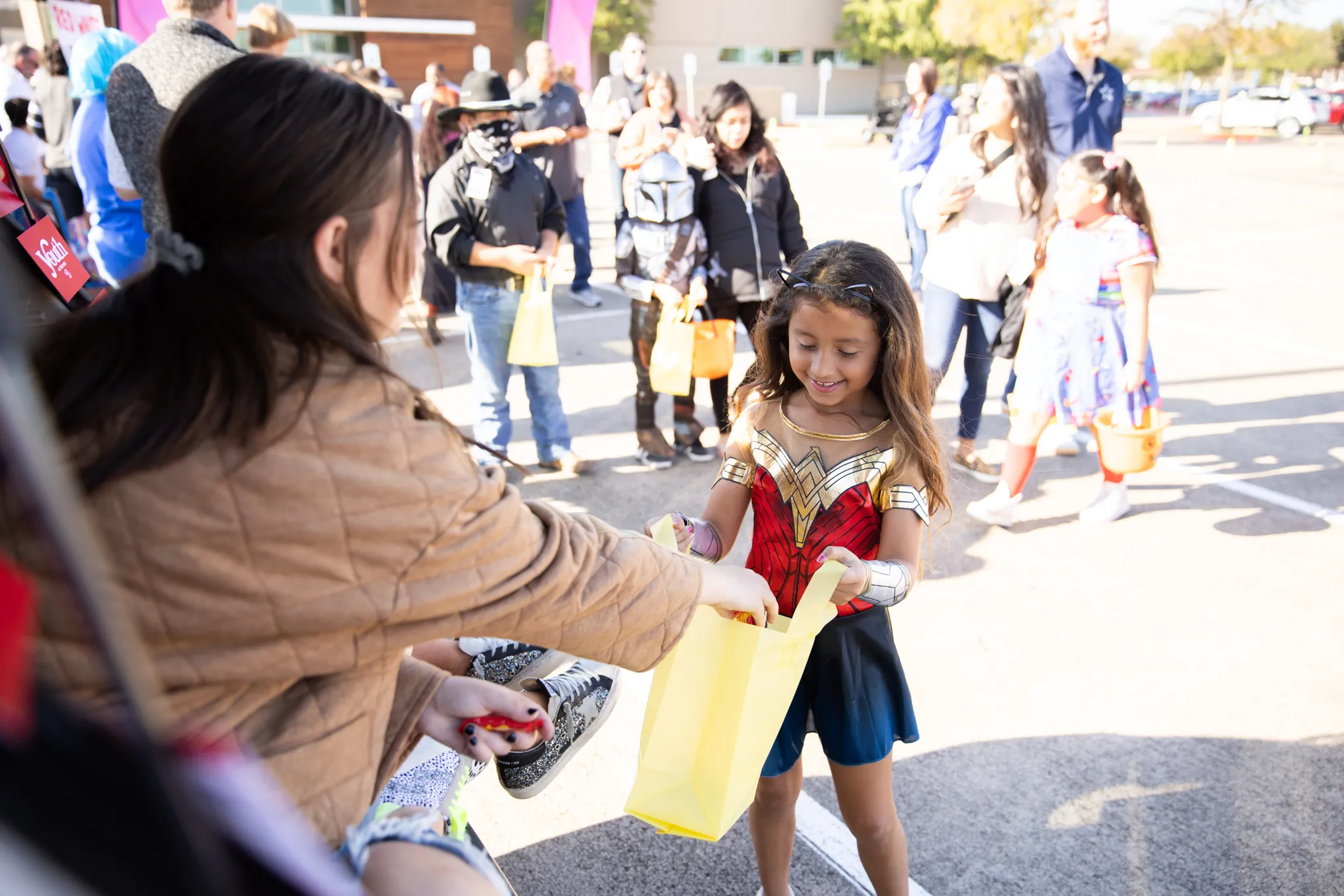 A girl getting candy on Super Sweet Sunday