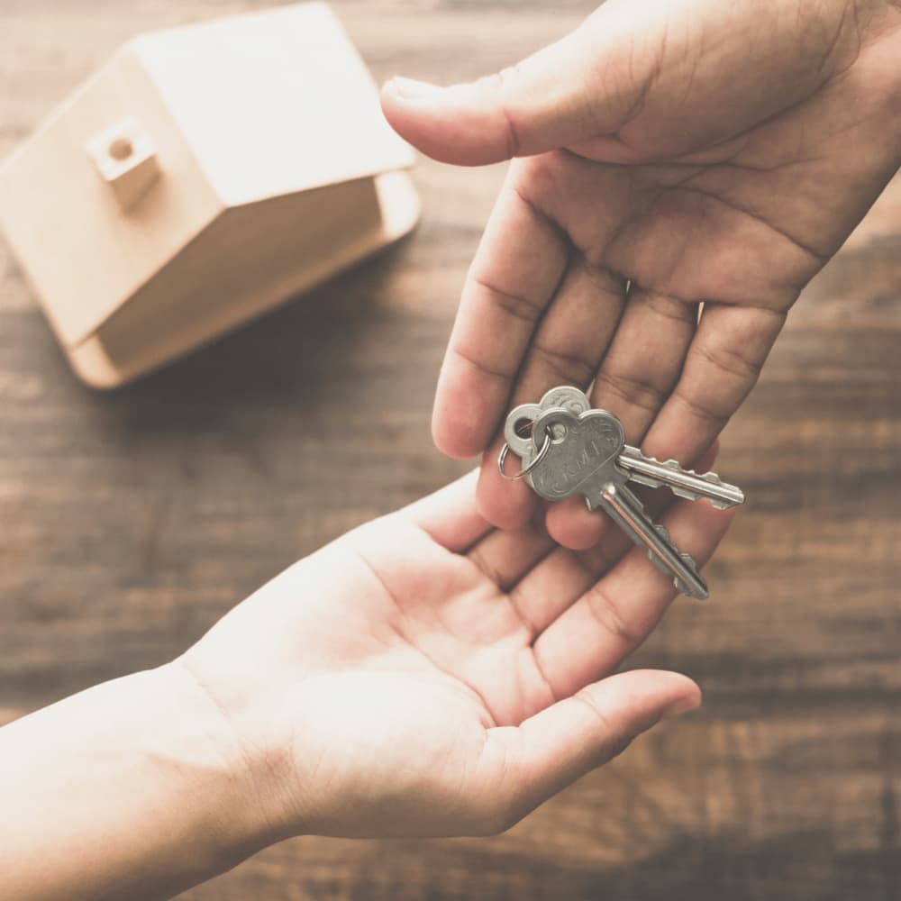 handing rental property keys to resident