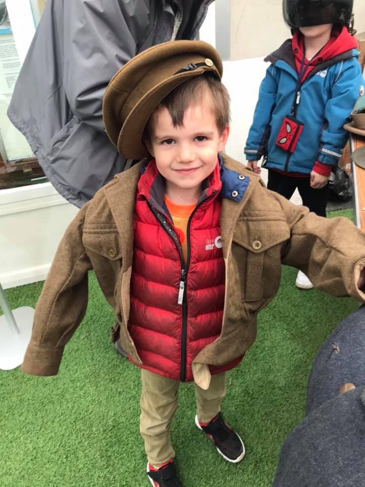 Young boy dressed up in a pilot's uniform at The De Havilland Museum