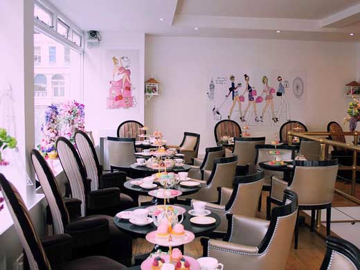 inside b bakery with tables set for afternoon tea