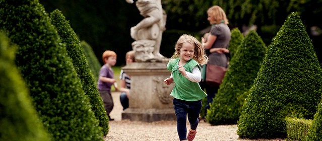 blonde girl running through Richmond Park