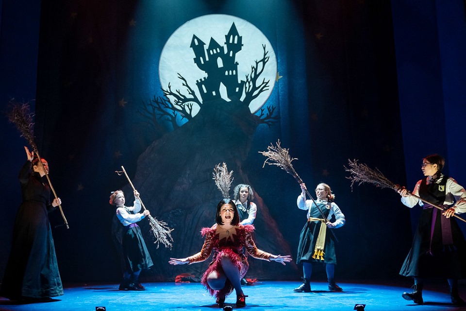 Pupils with their broomsticks in a flying lesson at Miss Cackle's Academy for Witches