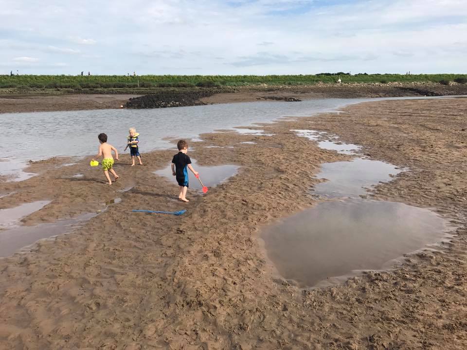 kids playing on norfolk beach
