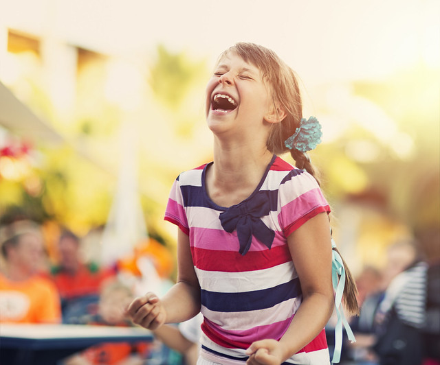 little girl laughing at Jewish Care