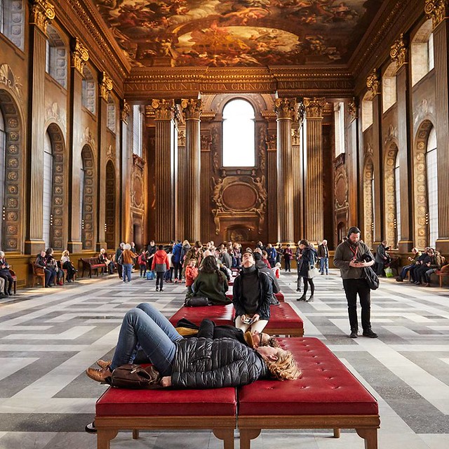 people marvelling at the brilliant painted hall