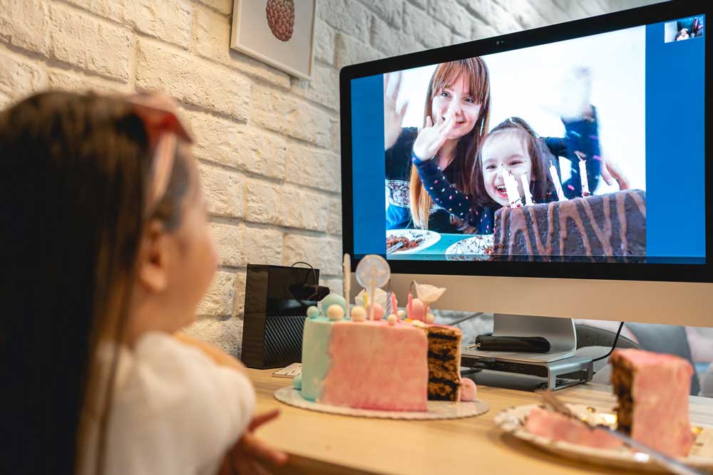 child talking to family on video call