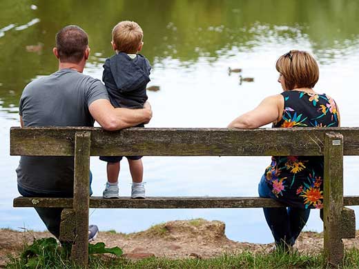 family sat on bench