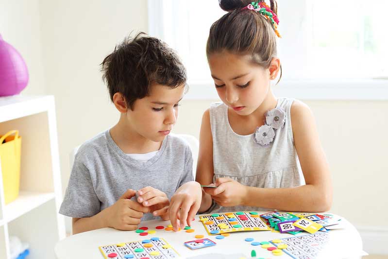 brother and sister playing bingo together