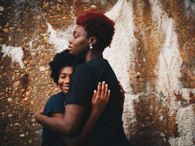 Parent and child hugging