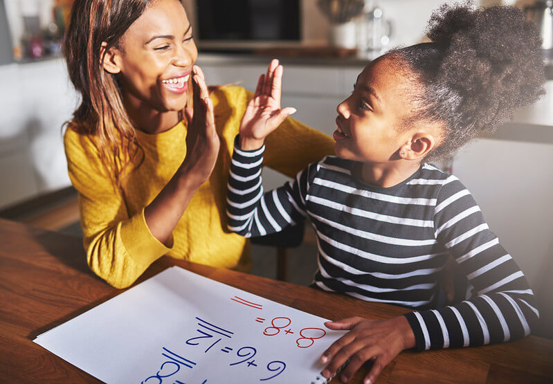 Parent helping child to learn maths to help them get great SATs results
