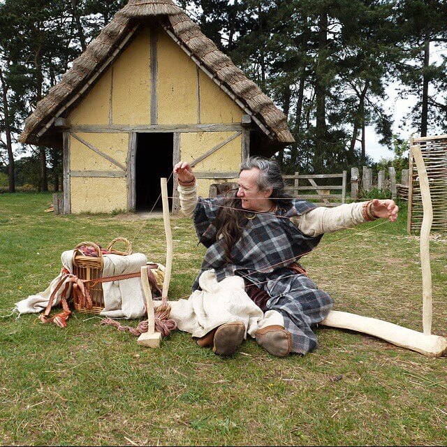 Woman Outside Anglo-Saxon Homes Demonstrating