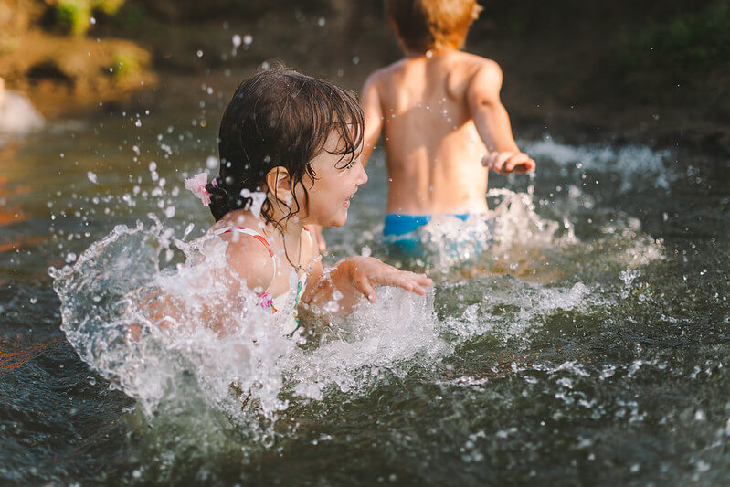 Children enjoying splashing in Cleveland Marine Lake, one of the best days out in weston super mare