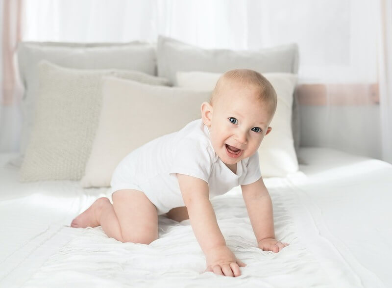 P named baby boy on the bed