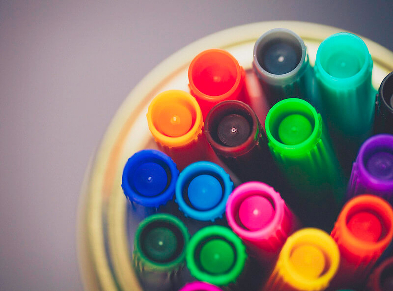 Coloured markers for colouring pages