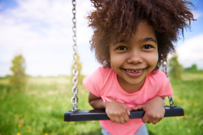 Little girl having fun after her haircut