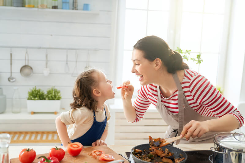 family making vegetarian dinner
