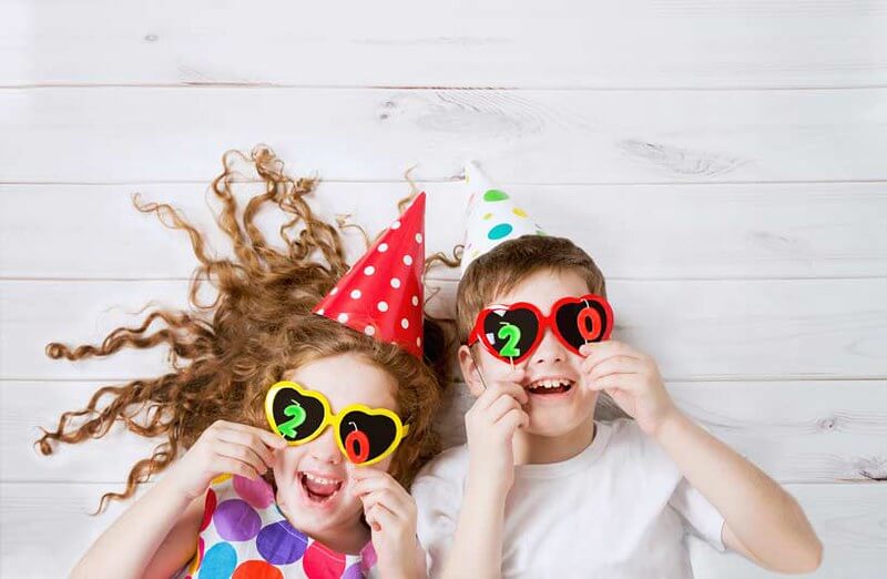 Kids laughing at new year holiday jokes