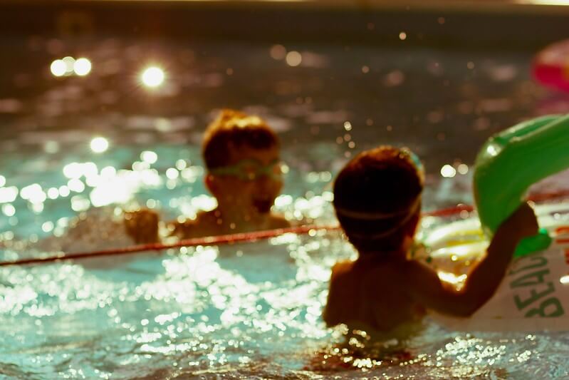 Boys playing in swimming pools during the new normal