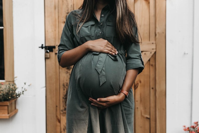 Mother deciding what to name her son, thinking of boys' names beginning with N
