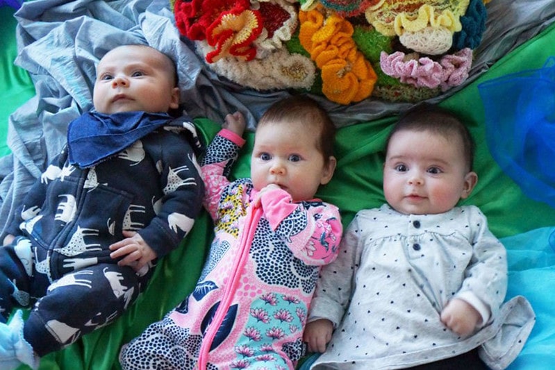 Murry, Murphy and Merlin, three babies on the floor, with magnificent boys' names beginning with M.