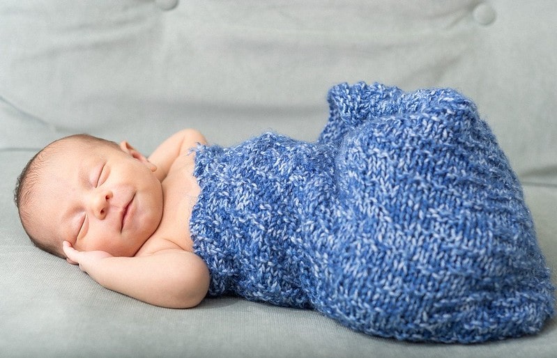 Sleeping baby in knitted sleeping bag