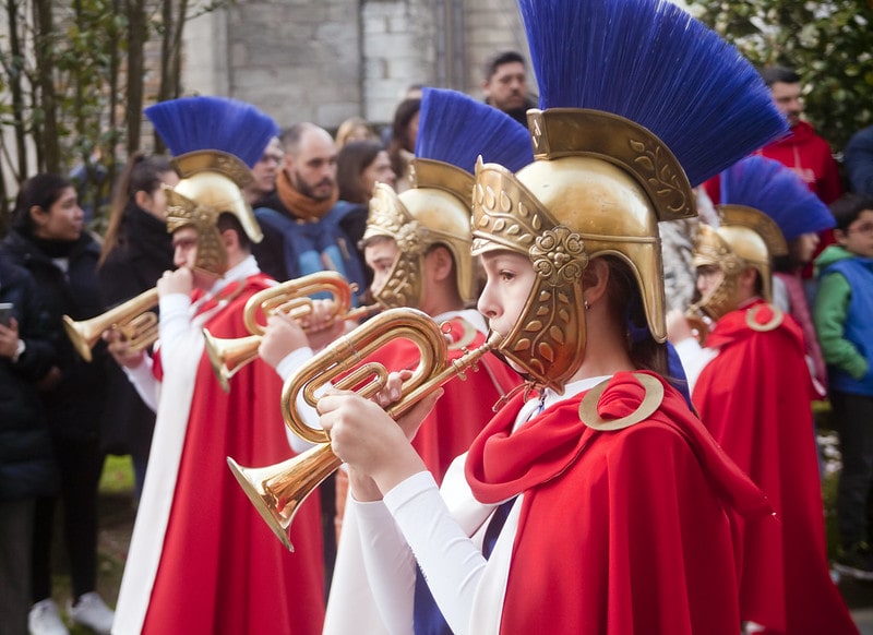 Boy Blowing Horn In Roman Armour Costume