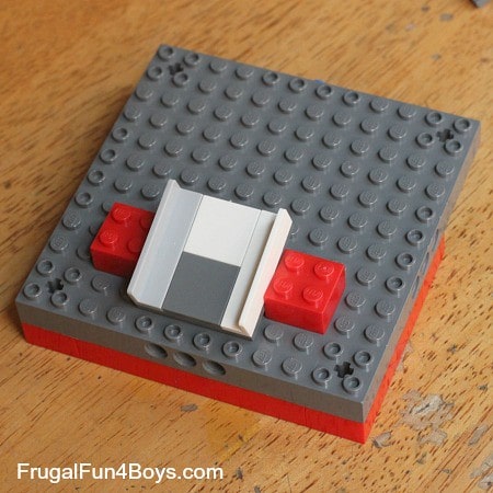 A demonstration of the ramp positioning for a lego candy dispenser