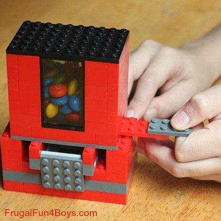 Demonstrating the dispensing action of the lego candy dispensers