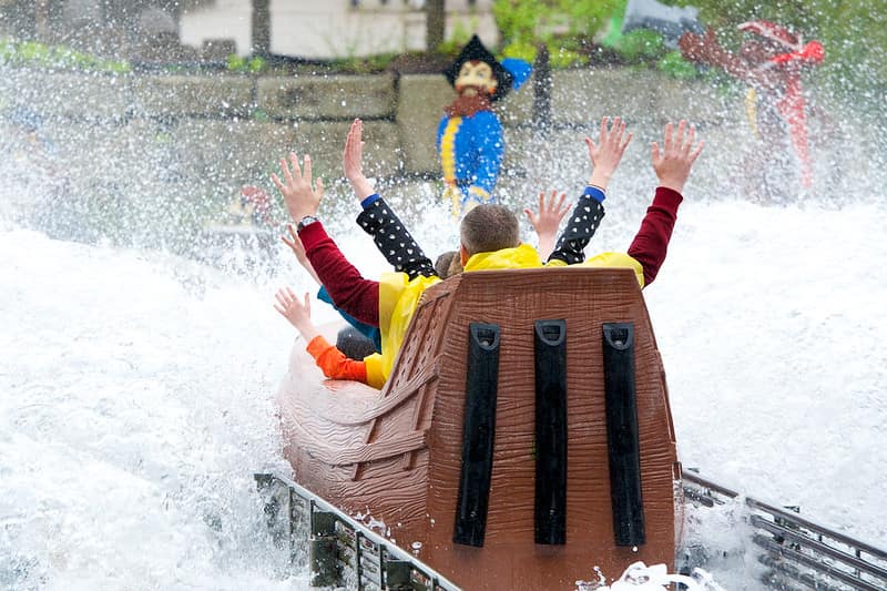 Family on Pirate Falls: Treasure Quest log flume ride.