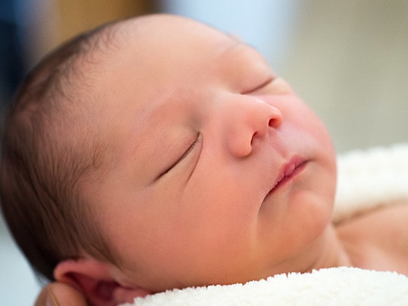 Newborn baby sleeping soundly.