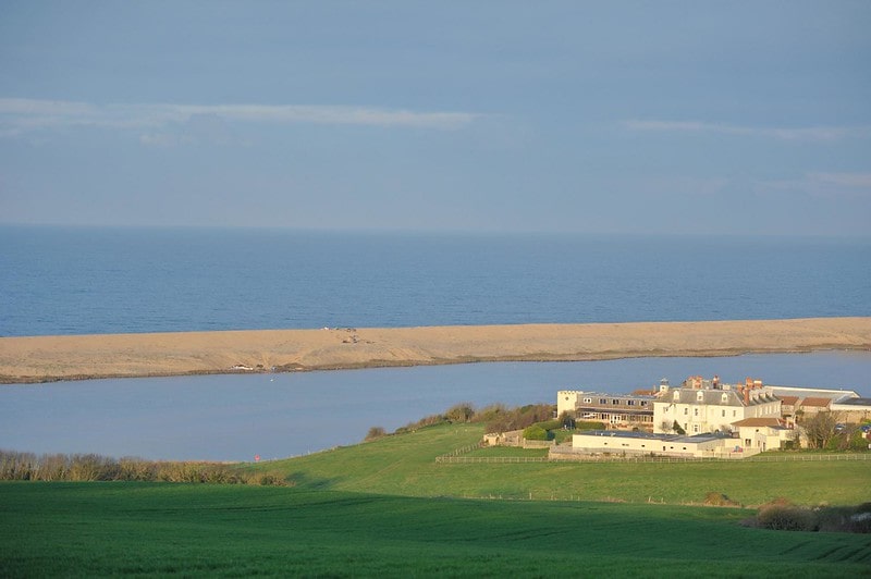 View of the sea from Moonfleet Manor set right by the water in Dorset.