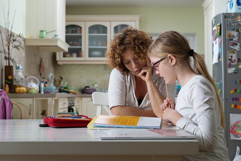 Mum helps her daughter study for twelve plus exams.