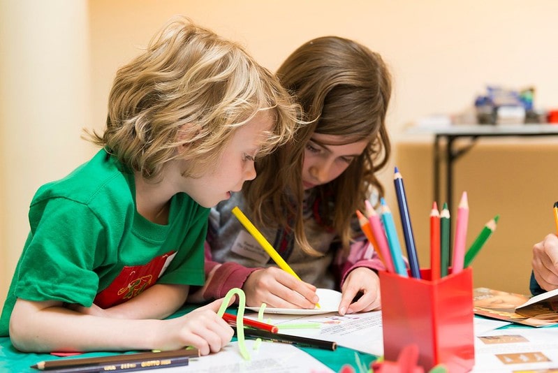 Children enjoying an activity at the Learning Room in the Royal Mews.