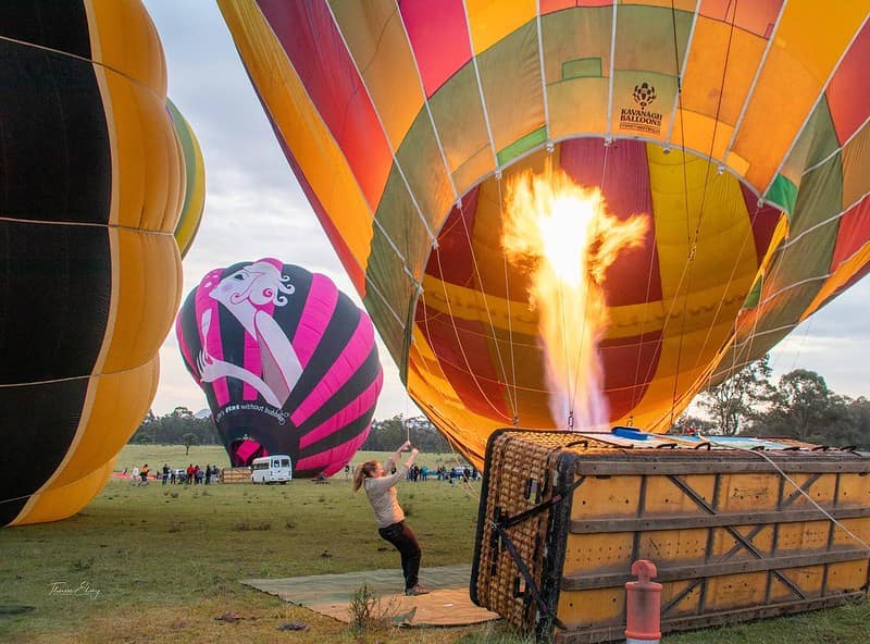 Hot air balloon being set up to lift into the air.