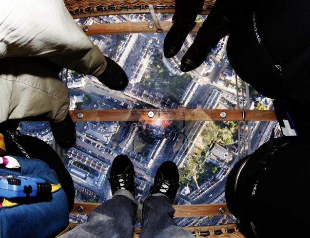 View looking down through a glass-bottomed hot air balloon.