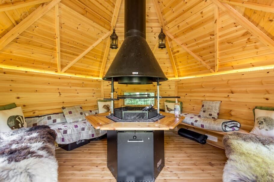 Inside an Arctic Cabin at New Forest Cottages, complete with fluffy blankets.