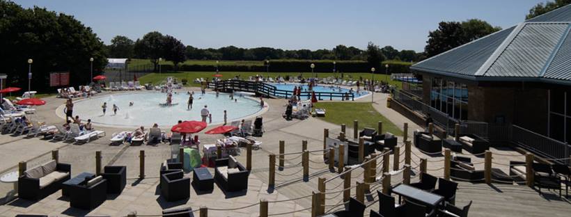 Families enjoying the swimming pool at Hoburne Bashley.