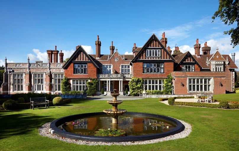 The grand front entrance to Macdonald Elmers Court with a fountain.