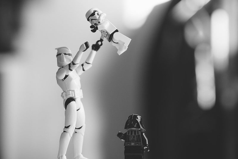 Lego stormtrooper playing with its child.