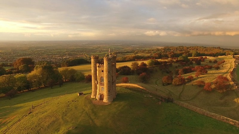 Aerial view of a castle in the Welsh countryside.