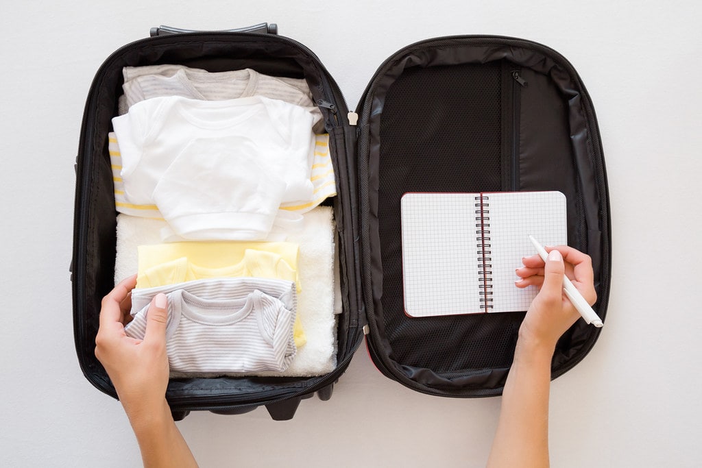 Small travel suitcase packed with the essentials for a water birth.