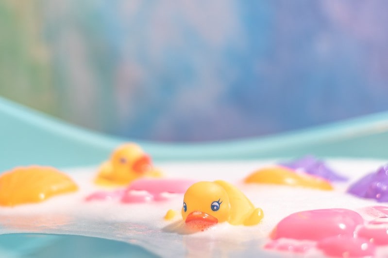 Rubber ducks in a tub of soapy water.