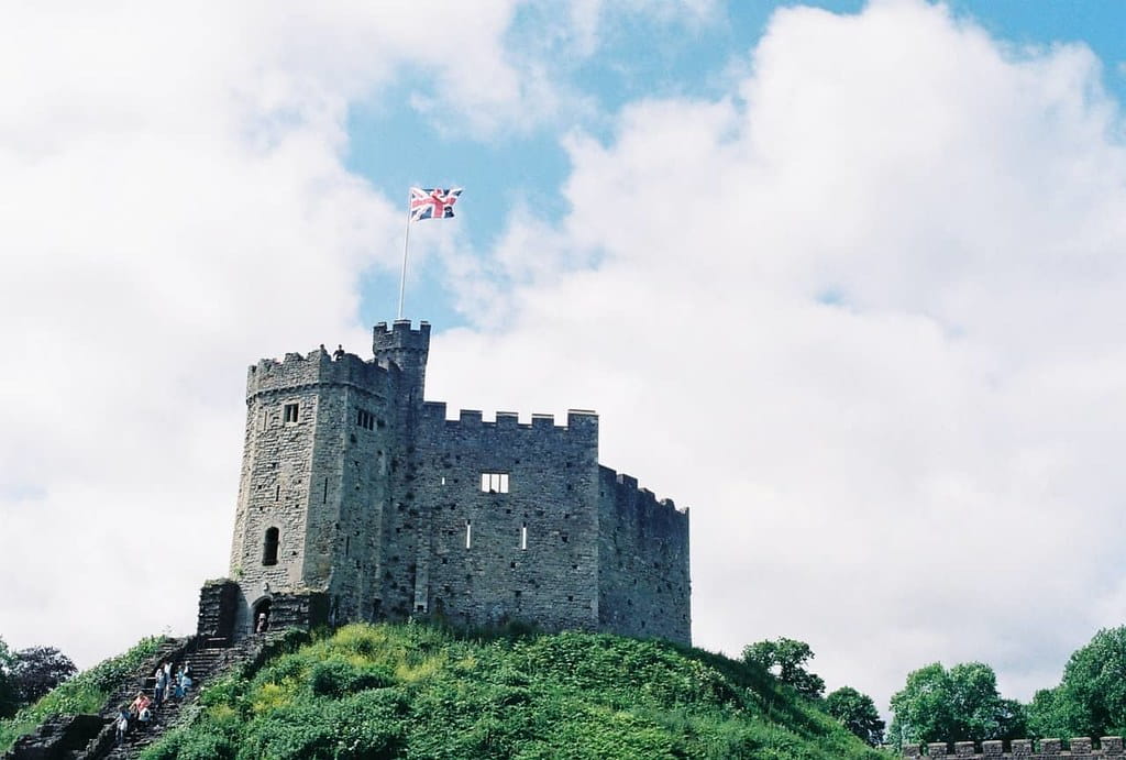 Tudor castle sat atop a hill with the Union Jack flying high.