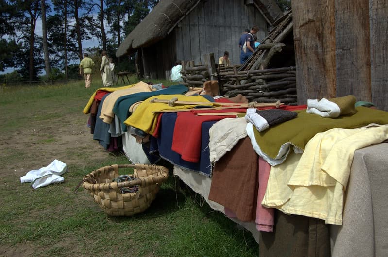 Various items of Anglo-Saxon clothing laid out on the table on display.