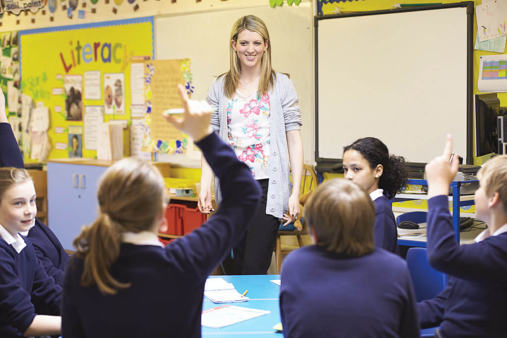 Kids in a KS2 classroom learning colons and semicolons.
