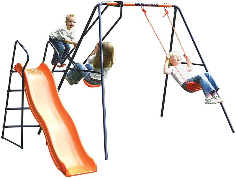 Children playing on the Hedstrom Saturn Garden Slide Set.
