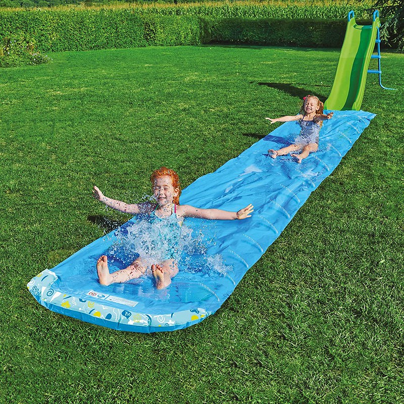 Children sliding down the TP Toys 6m Aqua Slide.