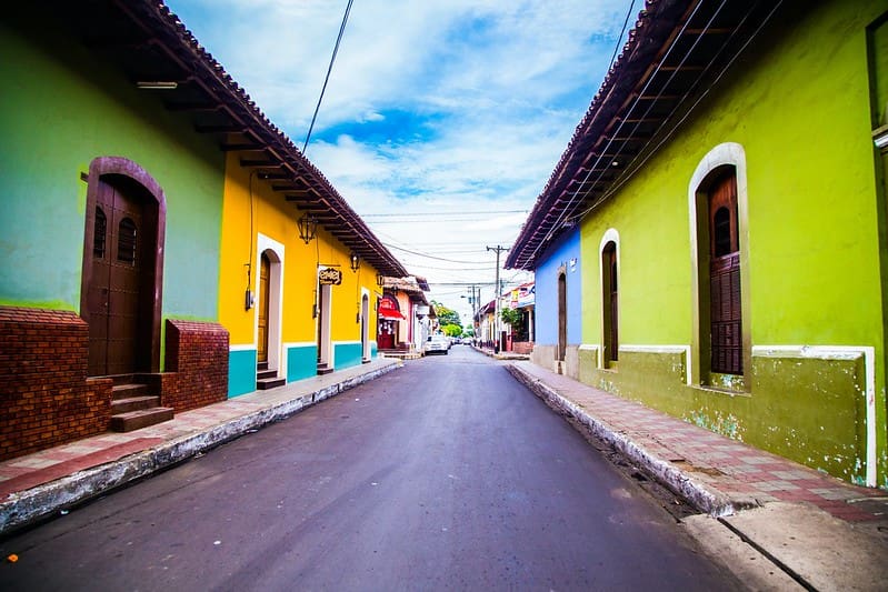 Street lined with colourful houses in Leon, Nicaragua.